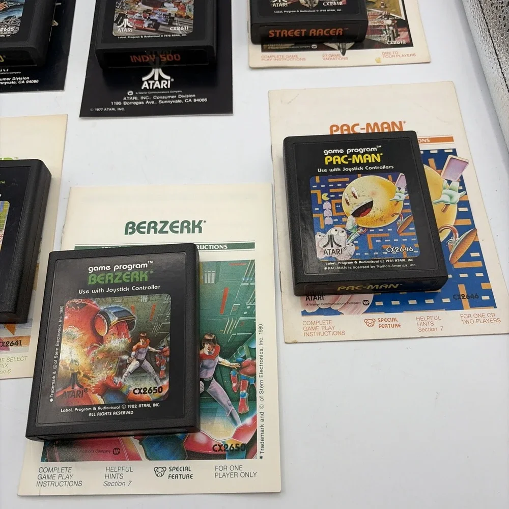 Lot of 8 Atari 2600 Games Pac-Man Pitfall Missile Command Berzerk with Manuals